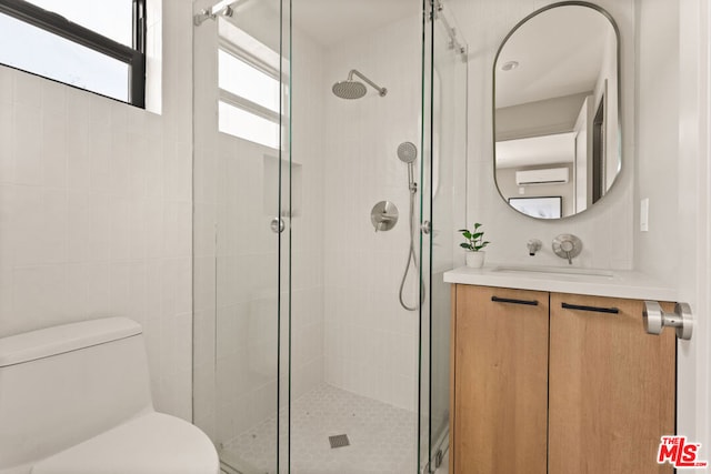 bathroom featuring walk in shower, vanity, and toilet