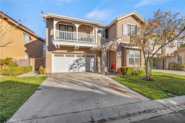 view of front of home featuring a balcony, a front yard, and a garage