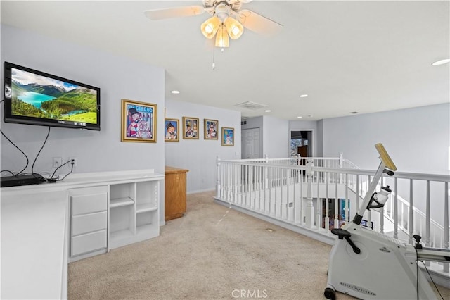 office featuring light carpet and ceiling fan