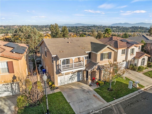 birds eye view of property with a mountain view