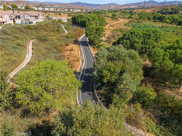 drone / aerial view featuring a mountain view