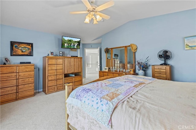 bedroom with ceiling fan, light carpet, and lofted ceiling