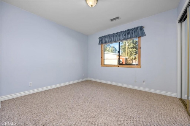 spare room with carpet floors