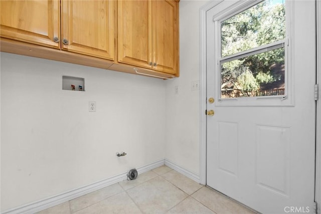 laundry room with cabinets, washer hookup, and light tile patterned flooring