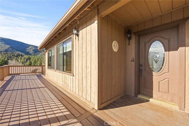 view of exterior entry with a mountain view