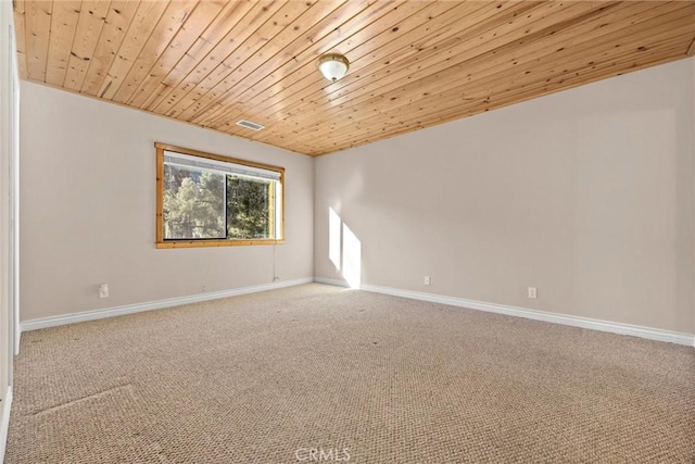 unfurnished room featuring carpet floors and wood ceiling