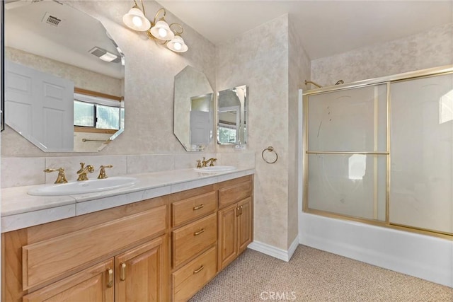 bathroom featuring tasteful backsplash, vanity, and enclosed tub / shower combo