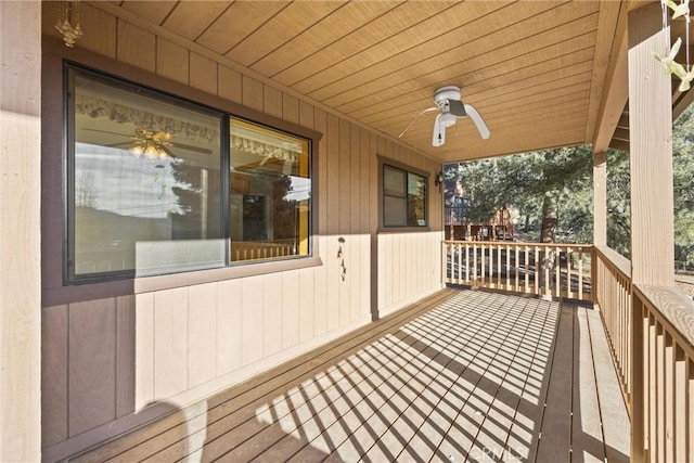 wooden terrace with covered porch and ceiling fan