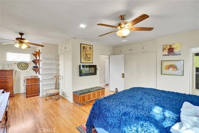 bedroom featuring light hardwood / wood-style floors and ceiling fan