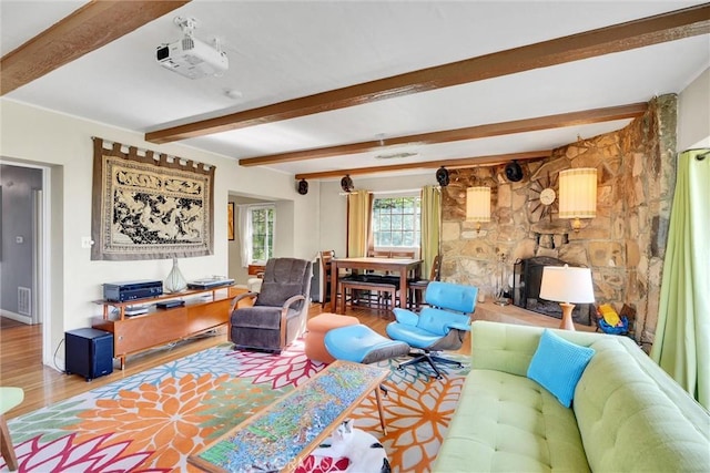 living room featuring wood-type flooring and beam ceiling