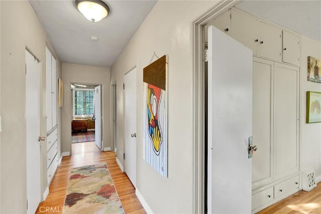 corridor featuring light hardwood / wood-style flooring