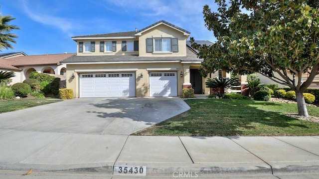 view of front facade with a front yard and a garage