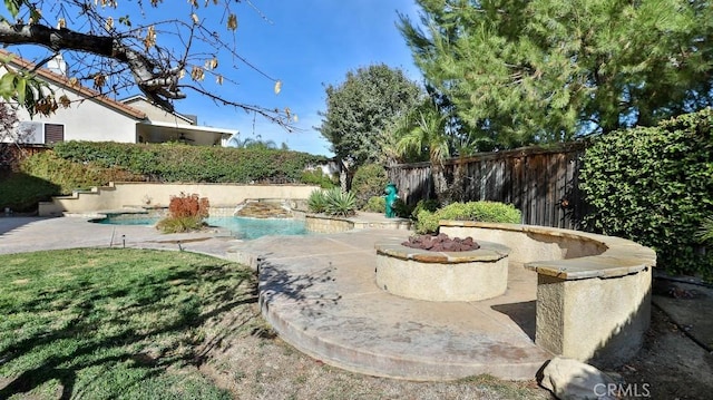 view of yard with a patio and a fenced in pool