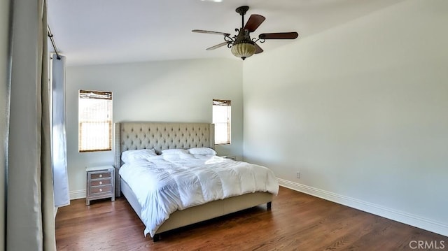 bedroom featuring ceiling fan, dark hardwood / wood-style floors, and lofted ceiling