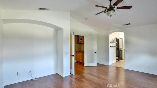 unfurnished room with ceiling fan, light hardwood / wood-style floors, and lofted ceiling