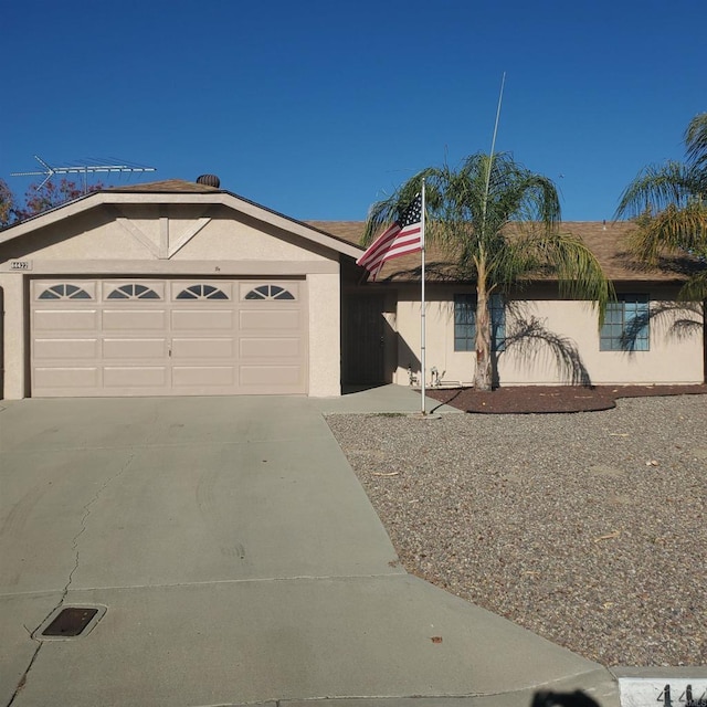 ranch-style house featuring a garage