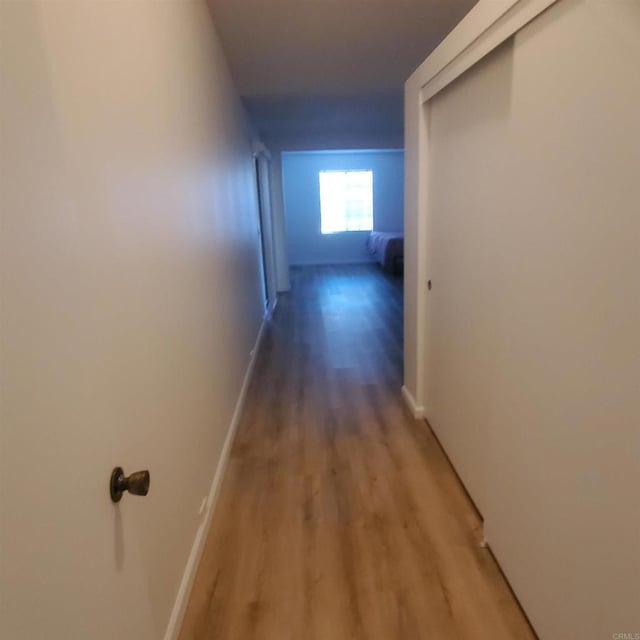 corridor featuring hardwood / wood-style floors