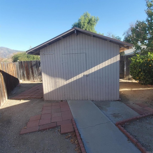 view of outbuilding with a mountain view