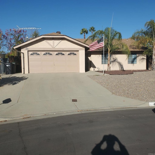 ranch-style house featuring a garage