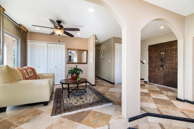 living room with ceiling fan