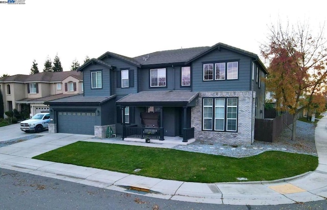 view of front facade featuring covered porch and a garage