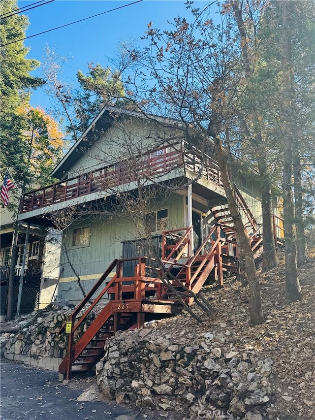 view of property exterior featuring a deck