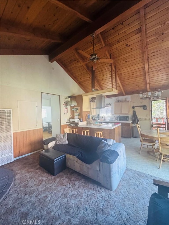 living room featuring beamed ceiling, carpet floors, wood ceiling, and high vaulted ceiling