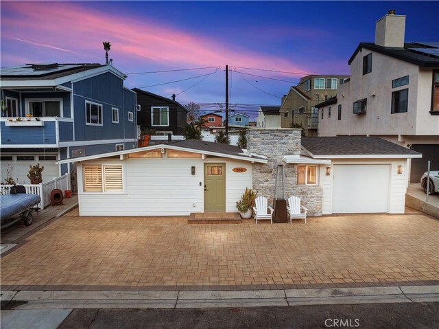 view of front of property featuring a garage