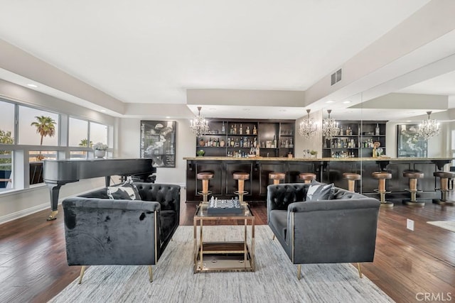 living room featuring hardwood / wood-style floors and indoor bar