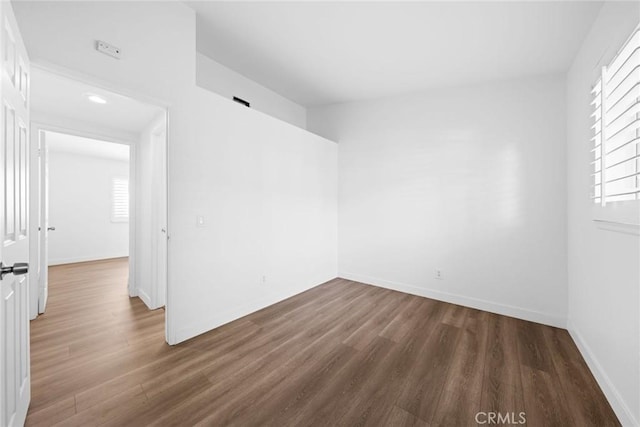 empty room featuring dark hardwood / wood-style floors