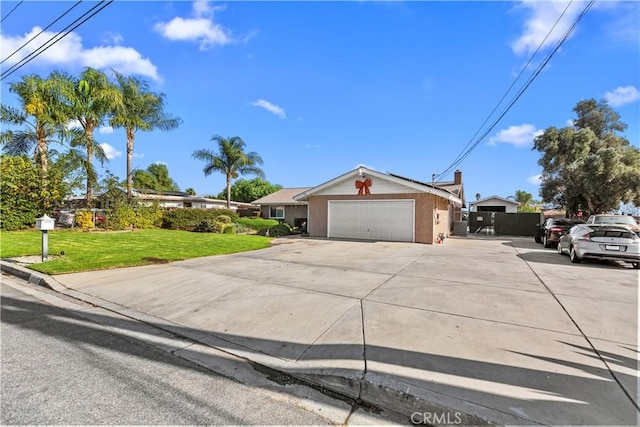 ranch-style home with a garage and a front lawn