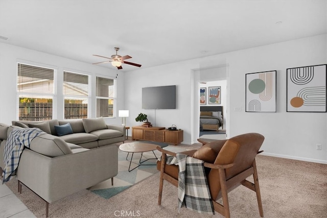 living room featuring light carpet and ceiling fan