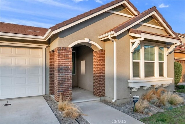 doorway to property featuring a garage