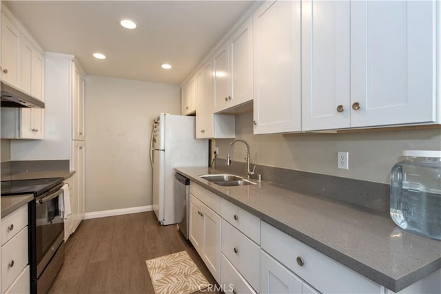 kitchen with a sink, electric range, white cabinets, and dishwasher