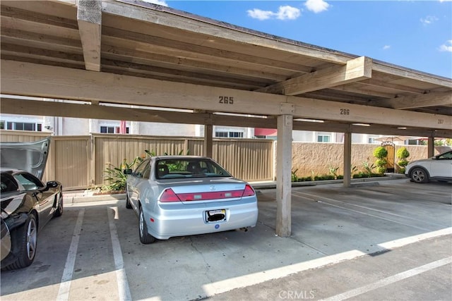 covered parking lot with fence