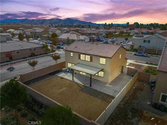 aerial view at dusk with a mountain view