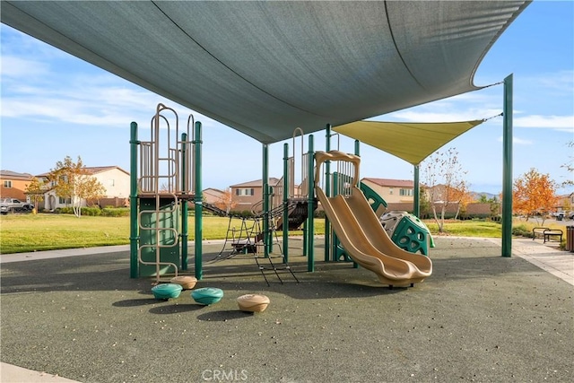 view of playground with a lawn