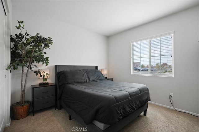 bedroom with light carpet