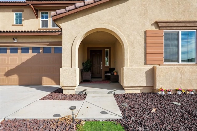 property entrance with a garage