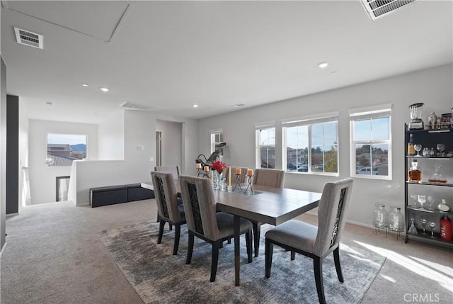 view of carpeted dining space