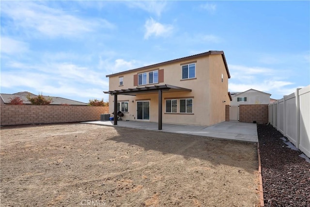 rear view of property with a patio area and central air condition unit