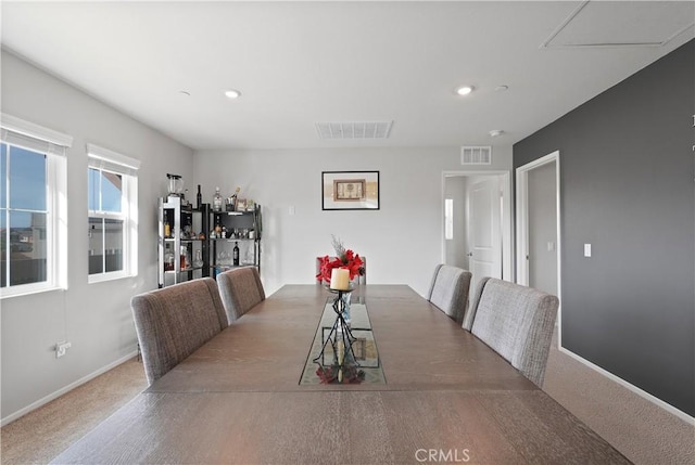 dining space featuring carpet floors