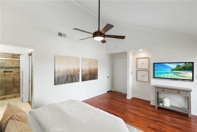 bedroom featuring ceiling fan, dark wood-type flooring, high vaulted ceiling, ensuite bathroom, and ornamental molding