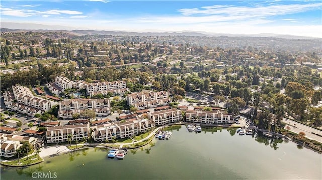 drone / aerial view with a water and mountain view