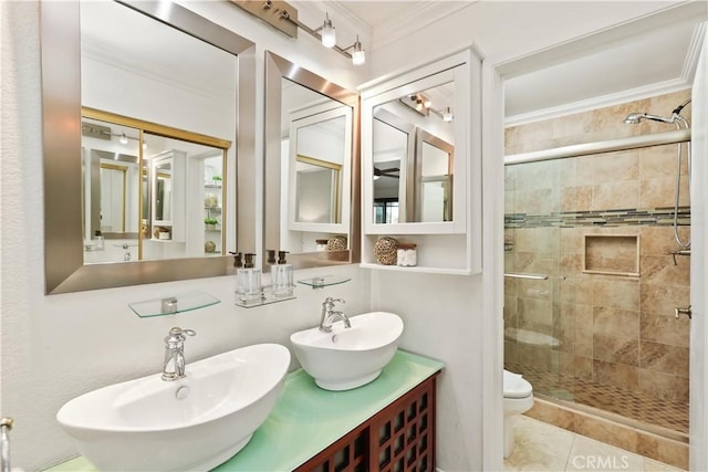 bathroom featuring tile patterned flooring, crown molding, an enclosed shower, toilet, and vanity