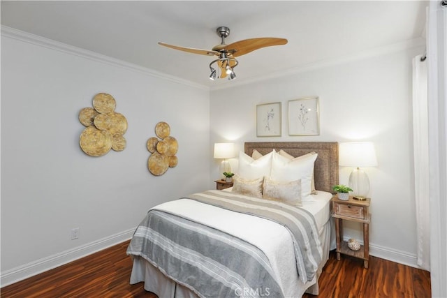 bedroom featuring ornamental molding, ceiling fan, and dark wood-type flooring