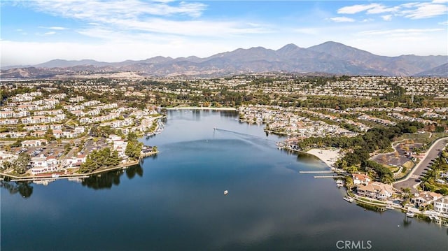 drone / aerial view featuring a water and mountain view