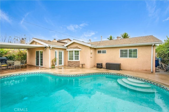 rear view of house featuring a patio