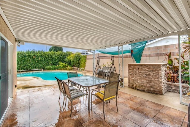 view of patio featuring a fenced in pool