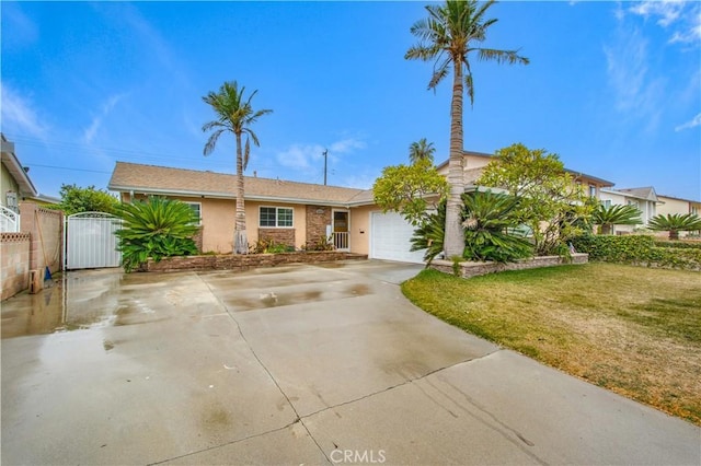 view of front of home with a garage and a front yard